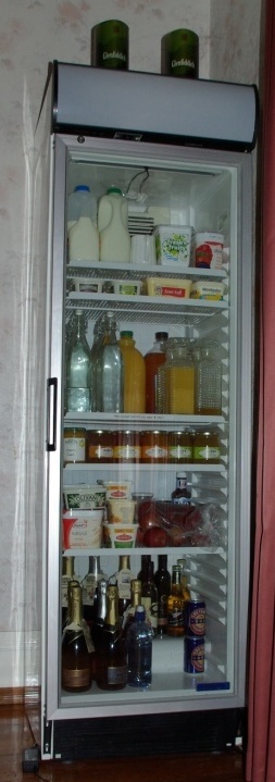 Photo of the glass fronted fridge in the dining room from which guests can help themselves to juices
and dairy products, etc